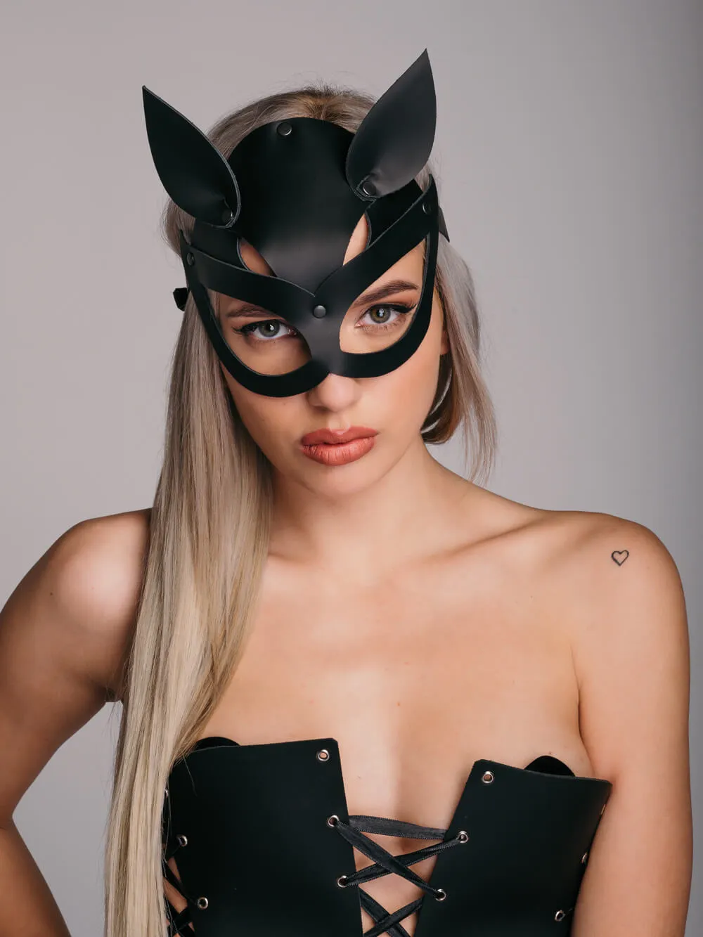 Handmade black erotic leather cat mask with eye holes and cat ears.