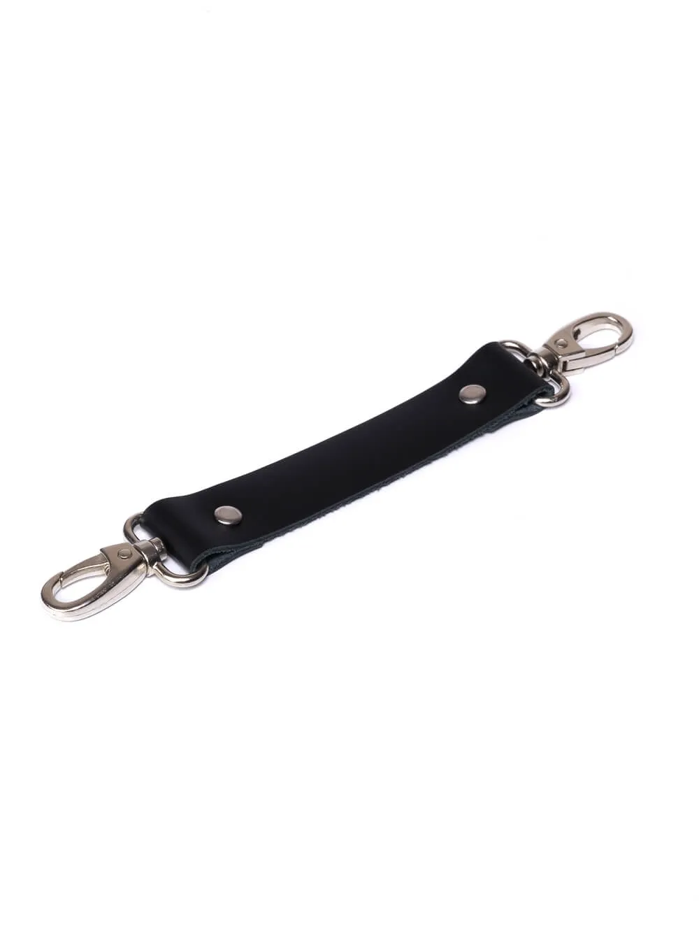 Leather strap connected with two carabiners. Clamp for tying and tightening BDSM and bondage sets.