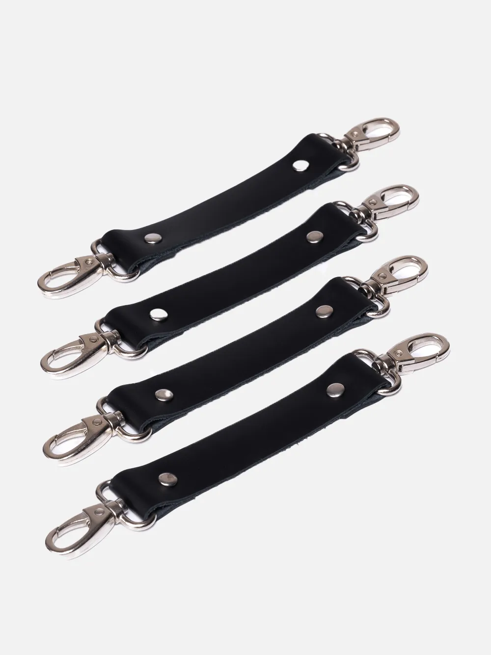 Leather strap - fastener with 2 carabiners for tying and fastening handcuffs and other BDSM and fetish accessories and harnesses.
