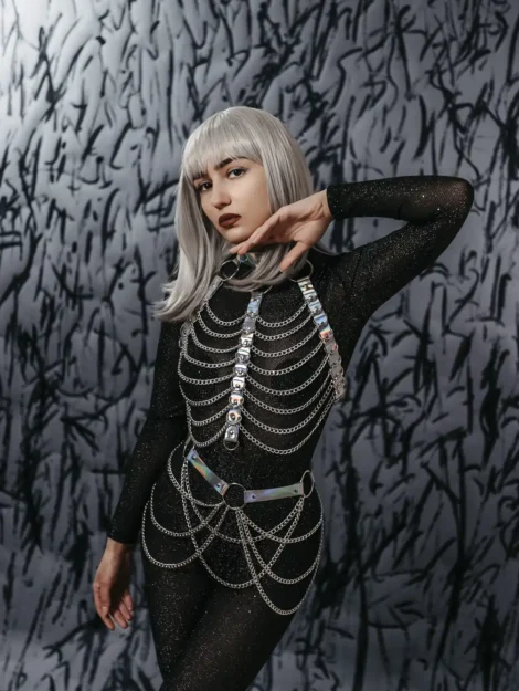Provocative space leather set for parties and festivals in genuine leather in hologram color with chains.