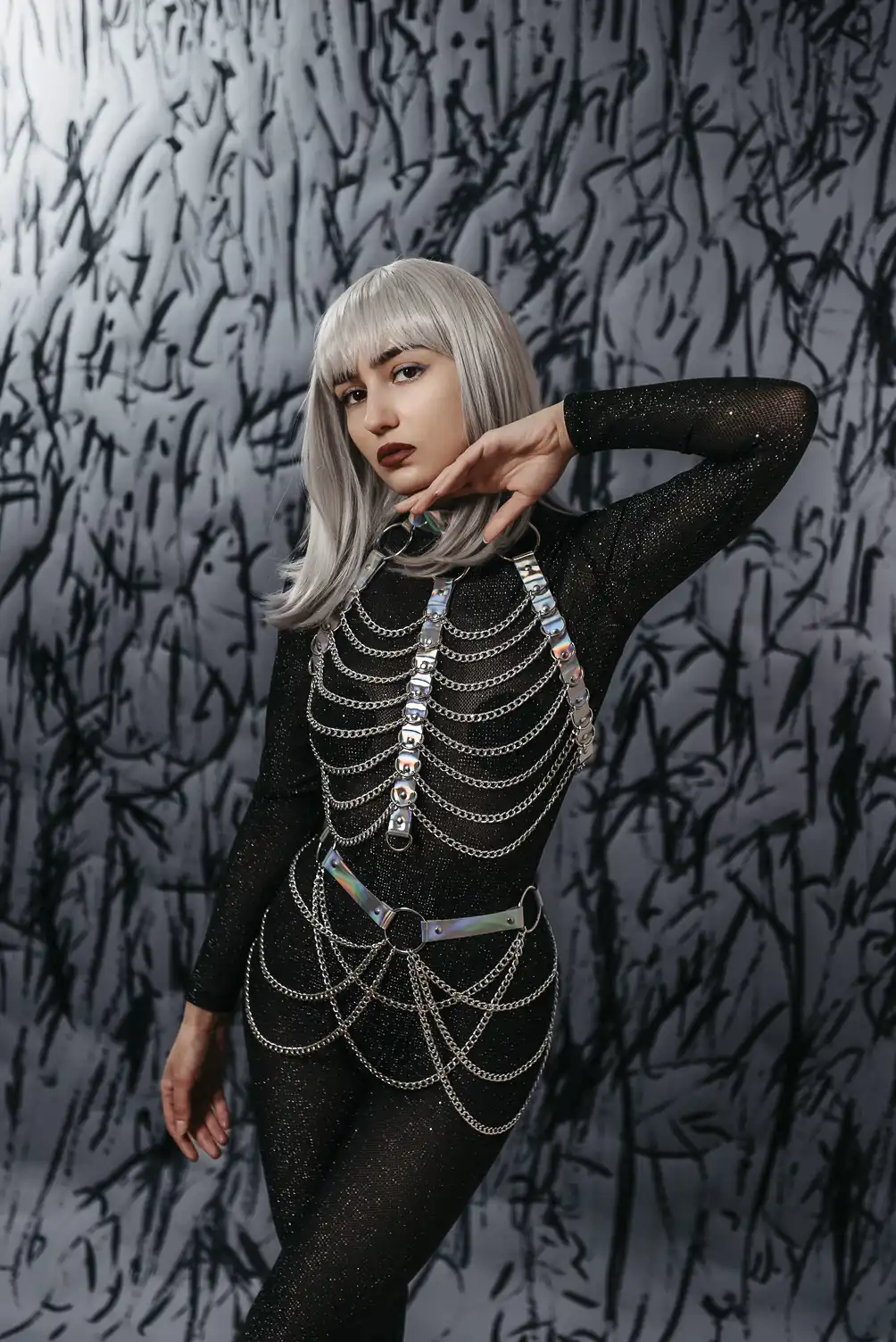 Provocative space leather set for parties and festivals in genuine leather in hologram color with chains.